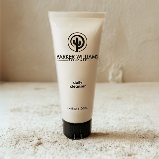 Tube of Parker Williams Skincare daily cleanser on a textured surface