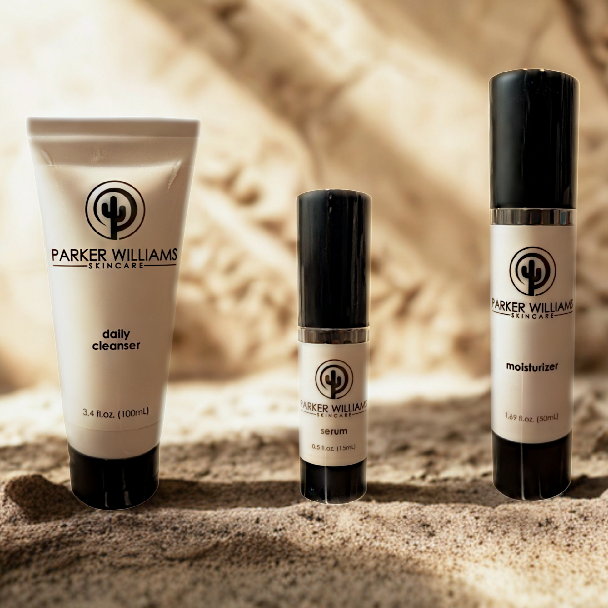 The Essentials Kit By Parker Williams Skincare. Three products, Daily Cleanser, Serum, Moisturizer.